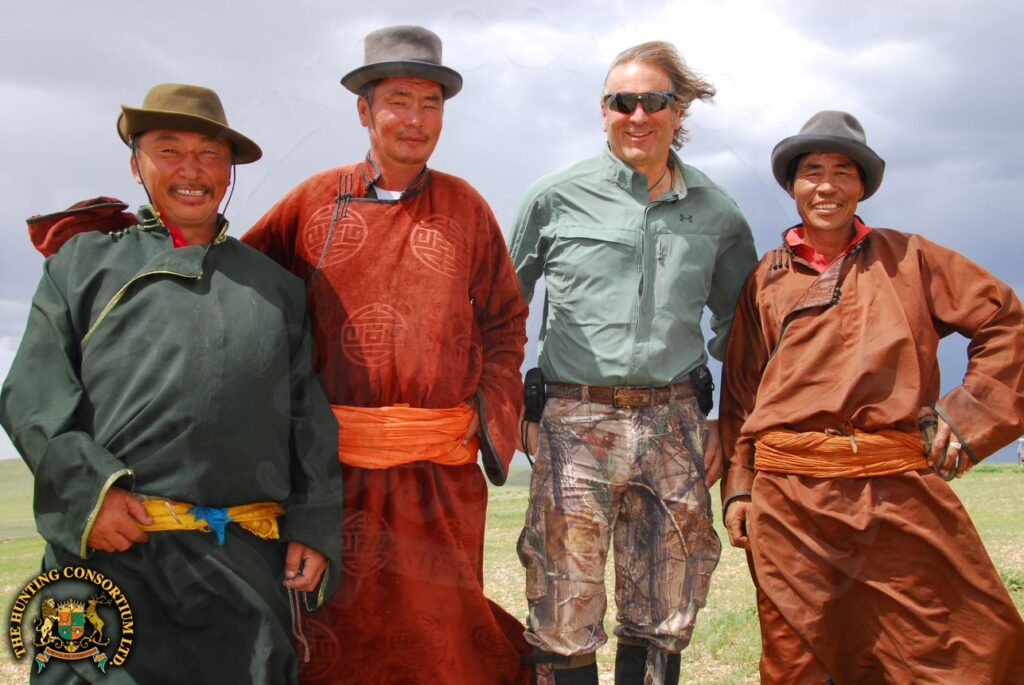 Mongolian Nomads posing with Jim Shockey while Hunting in Asia with Hunting Consortium