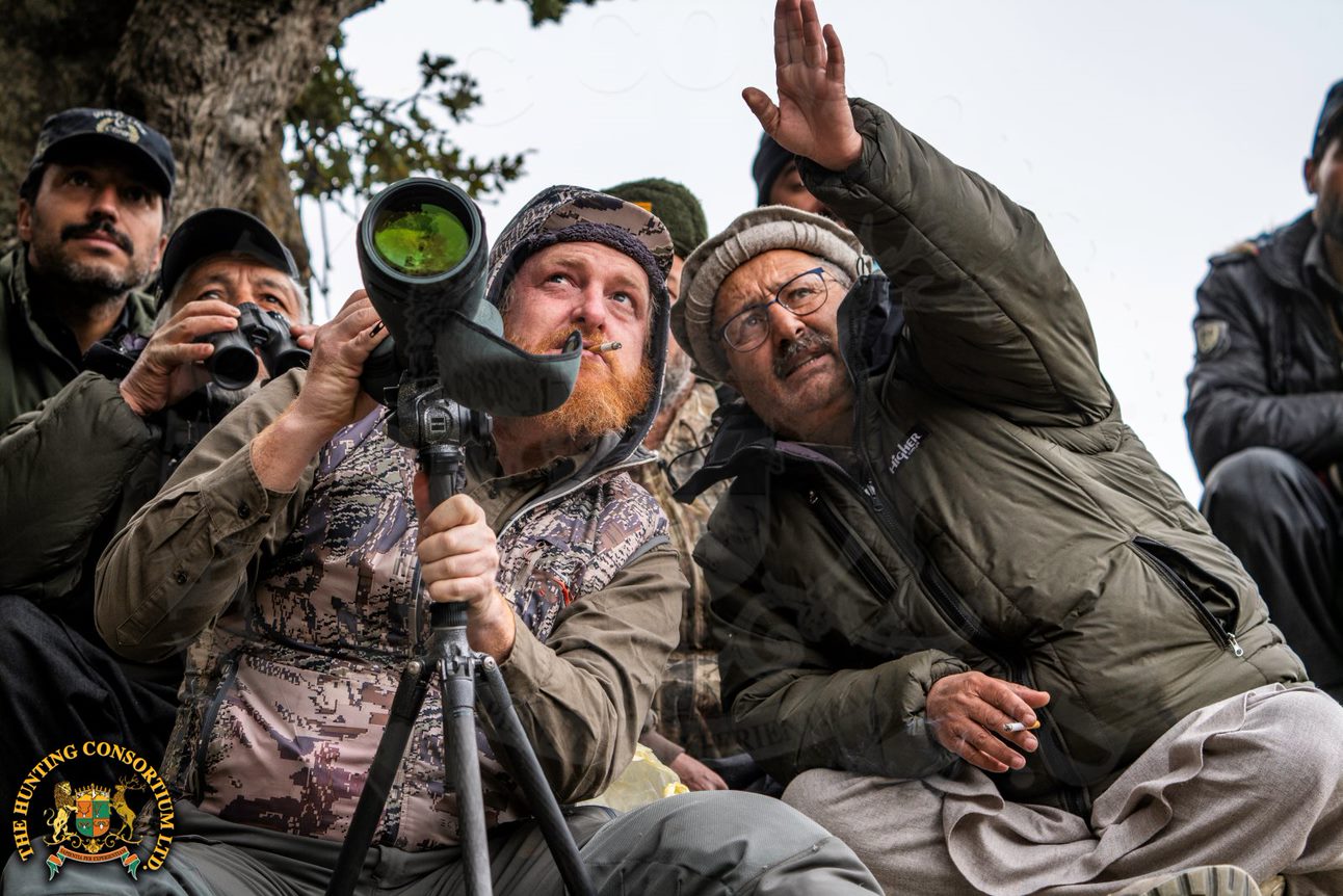Hunting Team Glassing on Mountain Side during Central Asian Hunts