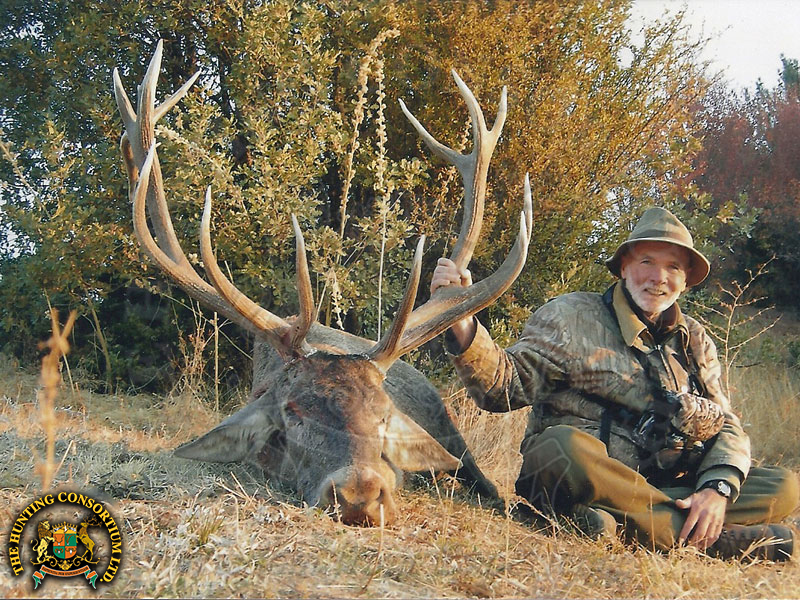 A picture of a man Mideastern Red Stag Hunting in Turkey. He is smiling on his Turkish hunt, and glad he chose to go wild hunting Turkey!